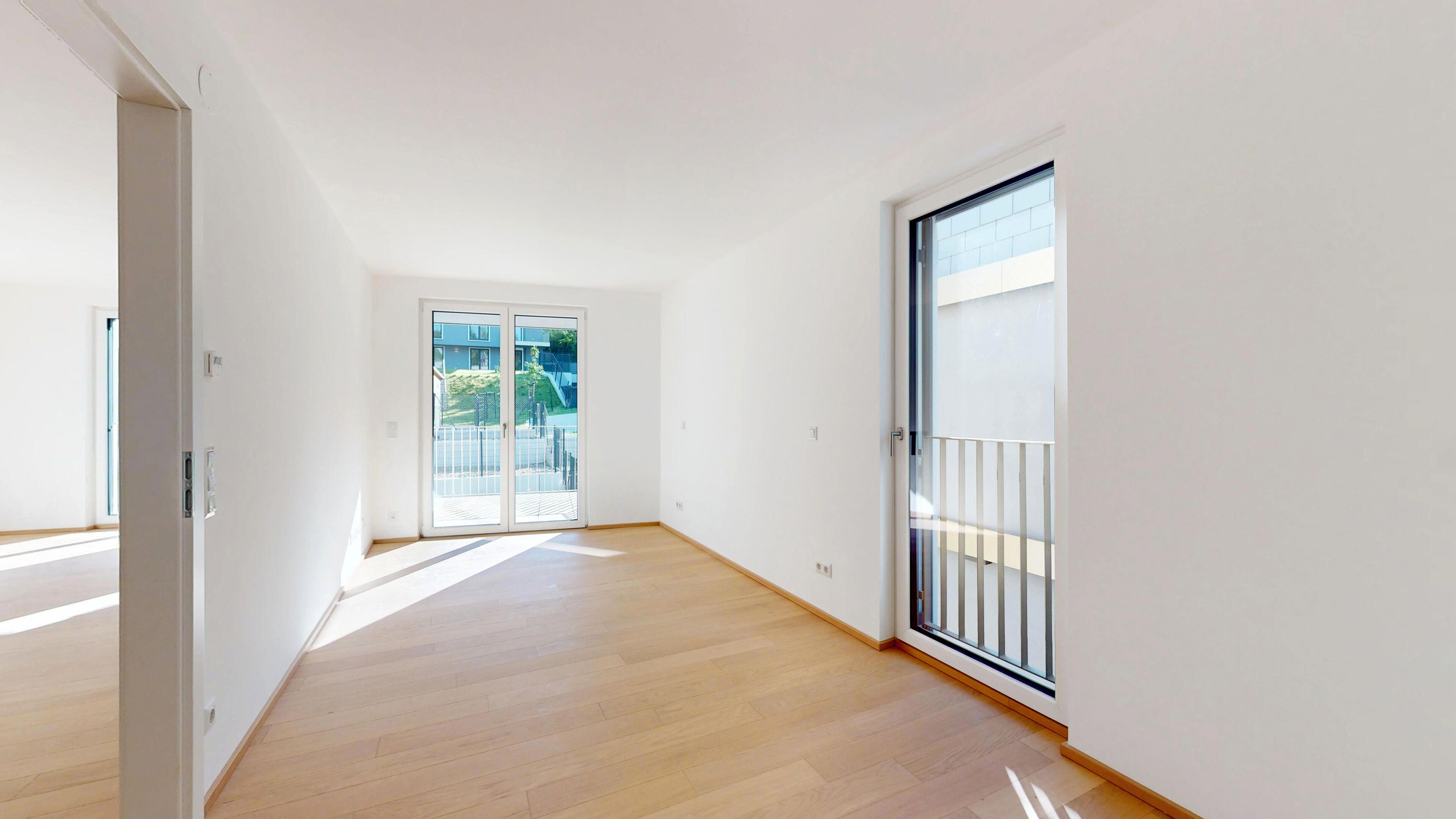 Ansicht eines Schlafraumes mit Zugang zur Terrasse