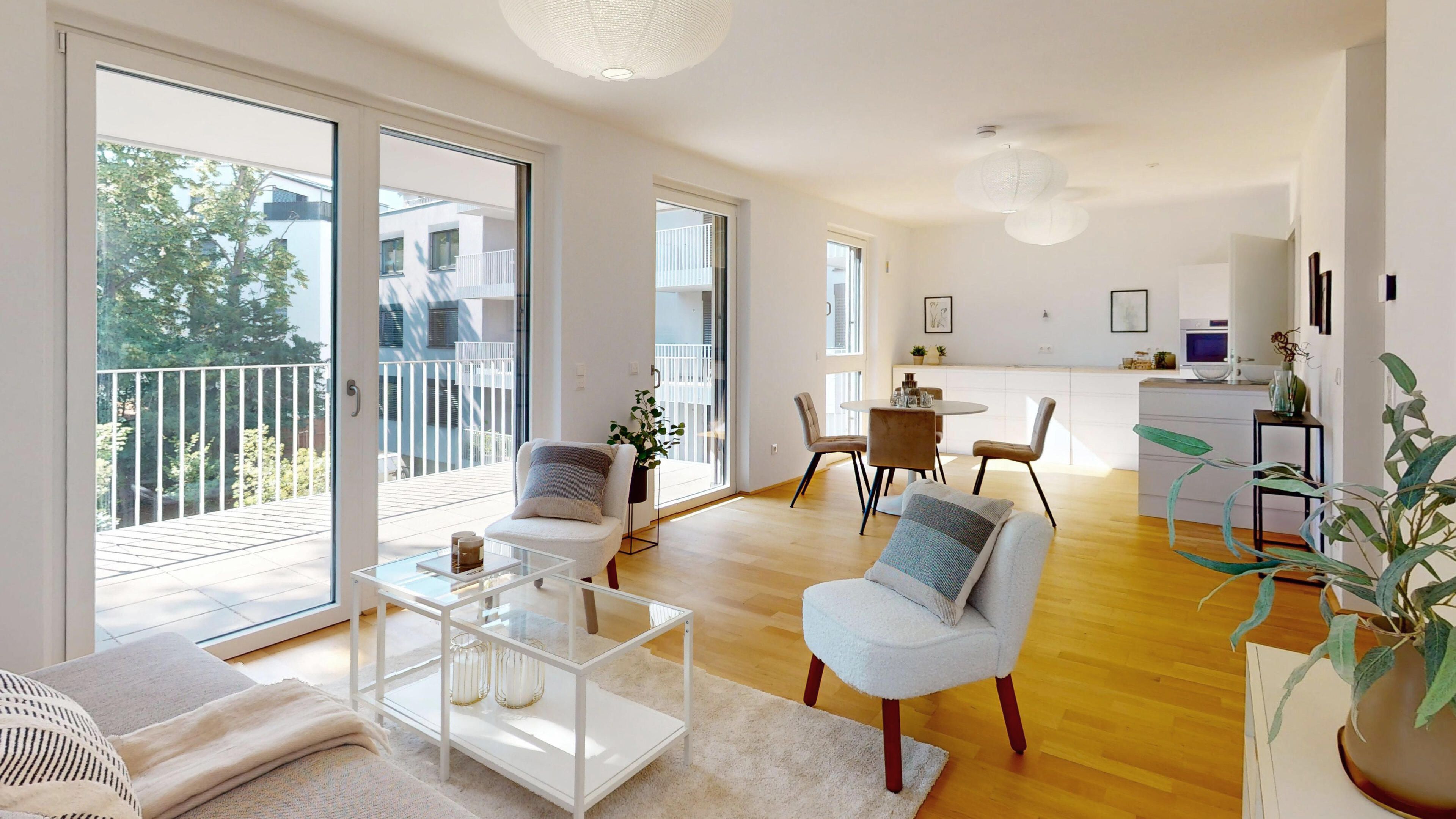 Darstellung eines sehr hellen, lichtdurchfluteten Wohn- und Esszimmers mit Mustermöblierung und Fensterfront