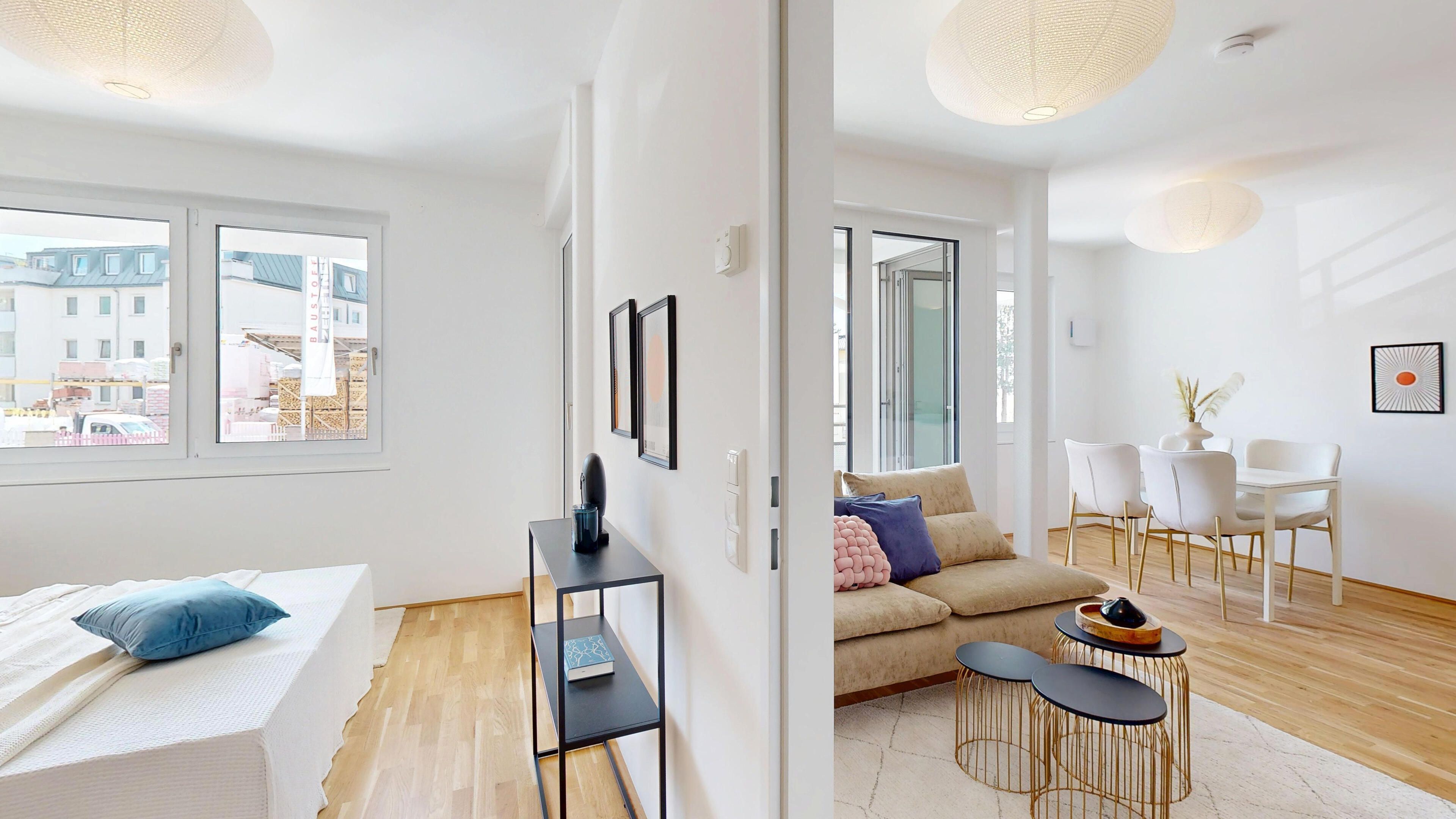 Ansicht des Schlafzimmer und des angrenzenden Wohn- und Essraums